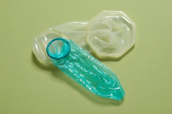 Unrolled Female Male Condoms Light Olive Background Safe Sex — Stock Photo, Image